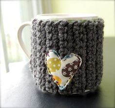 a crocheted coffee cup with a heart on it