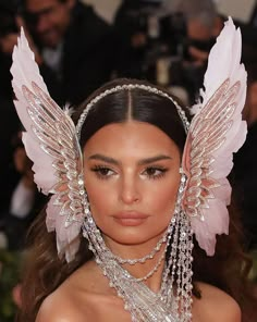 kim kardash is wearing angel wings on her head