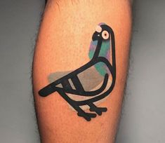 a bird tattoo on the leg of a man