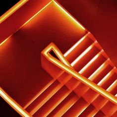 an image of a staircase in the middle of a room that is lit up with neon lights