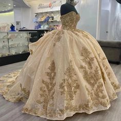 SPECIFICATIONS Material: COTTON Fabric Type: Tulle Pattern Type: Floral Age-targeted: All age Neckline: SWEETHEART Sleeve Length(cm): short Dresses Length: Floor-Length Style: Exquisite Actual Images: Yes Origin: Mainland China CN: Jiangsu is_customized: Yes Decoration: Appliques Decoration: Beading Decoration: CRYSTAL Decoration: FLOWERS Decoration: RUFFLES Decoration: Sequined Decoration: Pleat Built-in Bra: Yes Occasion: Quinceanera Item Type: Quinceanera Dresses Fashion Element: Candy Color Gold Fitted Dress For Quinceanera, Fitted Gold Dress For Quinceanera, Gold Ball Gown Dress For Quinceanera, Gold Ball Gown Quinceanera Dress For Party, Gold Ball Gown Quinceanera Dress For Debutante Ball, Gold Princess Dress For Quinceanera, Gold Ball Gown For Quinceanera Debutante Ball, Gold Ball Gown For Quinceanera Party, Gold Ball Gown For Quinceanera