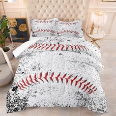 a baseball themed comforter set on a bed