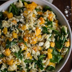 a white bowl filled with rice and vegetables