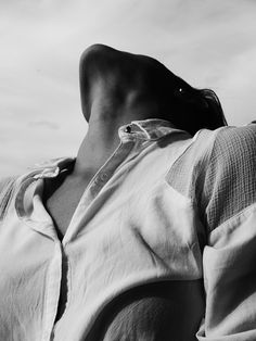 black and white photograph of a woman's back with her hands on her hips