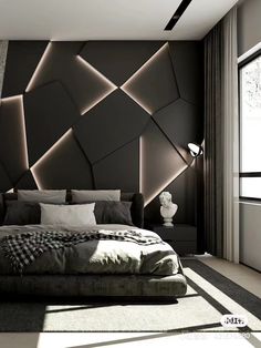 a modern bedroom with black and white wallpaper, grey bedding and large windows