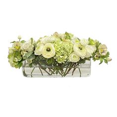 a vase filled with white flowers and greenery