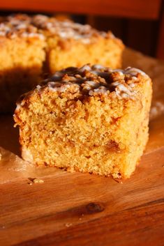 a piece of cake sitting on top of a wooden cutting board