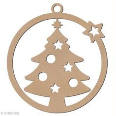 a wooden ornament with a christmas tree in the center and stars on it