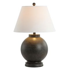 a table lamp with a white shade on it's base and a light bulb in the middle