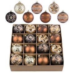 twelve christmas ornaments in a box on a white background