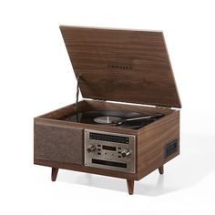 the record player is made from wood and has a built - in turntable for storage