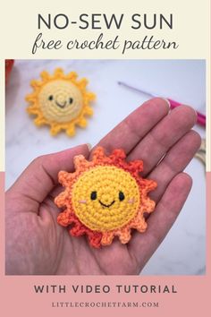 a hand holding a small crocheted sun with the words no sew sun free crochet pattern