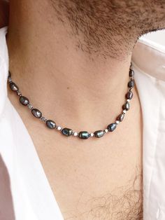 Mens black pearl necklace, Real pearl beaded y2k choker, Surfer hematite necklace, Boyfriend gift ideas, Black baroque pearl necklace men Pearls have long ceased to be in the arsenal of only women. Men easily complement their look with a classic string of pearls or a single pearl on a chain. It is not only fashionable and stylish, but also beautiful. Give this necklace to your boyfriend, believe me, he will not remain indifferent. I only use natural freshwater pearls so I don't have perfect identical round beads like plastic ones. Each pearl, like a person, is unique, with its own life story, each bead has its own stripes - these are mother-of-pearl layers. Black pearls are doubly unique and interesting. And in combination with faceted hematite, such a necklace will make you look modern, b Men Pearls, Y2k Choker, Pearl Necklace Real, Pearl Necklace Men, Necklace Boyfriend, Boyfriend Gift Ideas, Real Pearl Necklace, Black Pearl Necklace, Wear Pearls