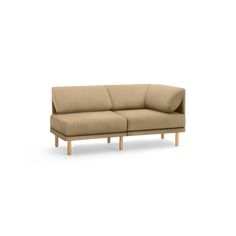 a beige couch sitting on top of a white floor