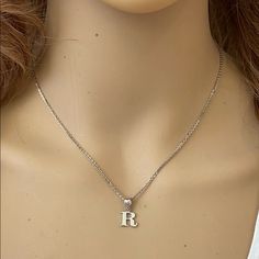 Description: 925 Sterling Silver Mini Small Initial Letter R Pendant Necklace Item No.: H89.Q Metal Type: 925 Sterling Silver (Available In 10k And 14k Gold) Metal Color: Silver Height With Bale: 15 Mm Width: 4.8 Mm Italian Rolo Chain In 16", 18", 20", Available In Another Listings In Any Letter A-Z Dainty Silver Necklaces With Initials, Silver Dainty Initial Pendant Necklace, Dainty Silver Initial Pendant Necklace, Silver Initial Necklace In Sterling Silver, Silver Initial Pendant Necklace With Clavicle Chain, Silver Initial Necklace For Everyday Wear, Silver Initial Necklace With Clavicle Chain For Anniversary, Silver Sterling Silver Initial Necklace For Everyday, Nickel-free Silver Sterling Initial Necklace