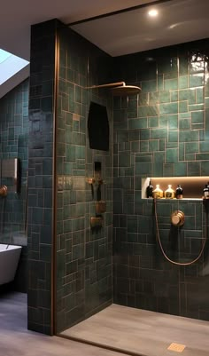 a bathroom with green tiles and gold fixtures