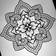 a black and white drawing of a flower