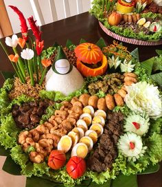 a table topped with lots of different types of food and decorations on top of it