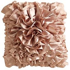 a decorative pillow with ruffles on it