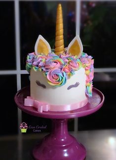 there is a cake that looks like a unicorn's head