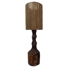 a wooden table lamp with a brown shade