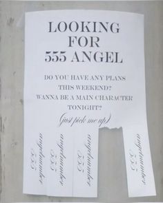 a sign posted on the side of a building that says looking for 555 angel