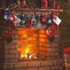 a fireplace with stockings hanging from the mantle