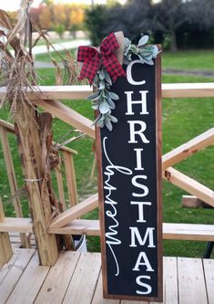 a wooden sign that says christmas on it