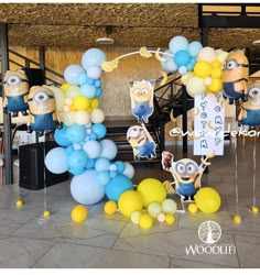 balloons and decorations are arranged in the shape of minion characters