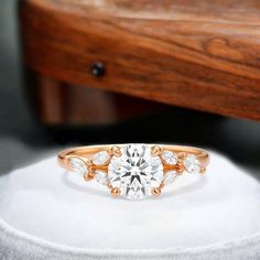 an engagement ring with three diamonds on it