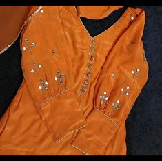 -Orange color salwar suit for women -fabric used Pure crepe of suit and pure organza for dupatta - colour Rust orange - Handwork details on puffed sleeves - size (customisation available) -Dry clean only Bridal Suits Punjabi, Salwar Suit For Women, Bridal Suits, Suits Punjabi, Orange Suit, Salwar Pattern, Neck Designs For Suits, Womens Suits, Suit For Women