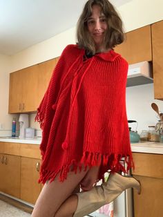 Poncho is a one size fits all size. Red Long Sleeve Poncho, One Size, Red One-size Poncho Cape, Red One-size Cape Poncho, Red One Size Cape Poncho, Red Oversized Poncho, Oversized Red Poncho Cape, Knit Fabrication Poncho For Fall, One Size, Red Oversized Poncho For Winter, Knit Fabrication One-size Poncho For Fall