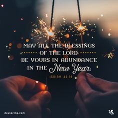 two hands holding sparklers with the words, may all the blessings of the lord be yours in abundance in the new year