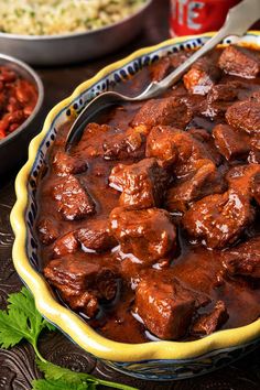 a close up of a bowl of food on a table