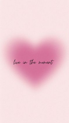 a pink heart with the words live in the moment