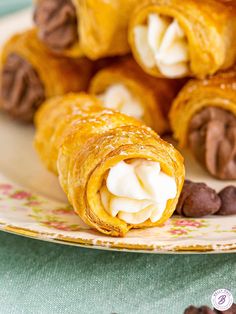 chocolate and cream filled croissants on a plate