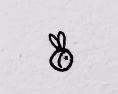 a black and white image of a bunny's head drawn on the side of a wall