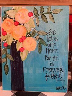 a painting with flowers painted on it that says she holds her hope for he is forever beautiful