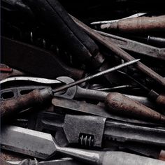 a pile of tools that are sitting on top of each other