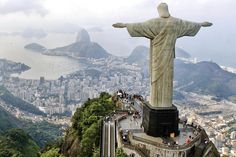 the statue of christ stands high above the city