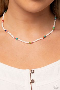 Infused on an invisible wire, white seed beads, silver studs, and circular multicolored stones coalesce around the collar for a puka-shell look-alike layer. Features an adjustable clasp closure. As the stone elements in this piece are natural, some color variation is normal. Sold as one individual necklace. Includes one pair of matching earrings. White Beaded Choker For Vacation, Adjustable Heishi Beads Choker, White Choker With Colorful Beads For Vacation, Adjustable Beaded Shell Strand Necklace, White Round Beads Choker For Beach, White Festival Jewelry Choker, White Festival Choker Jewelry, Adjustable White Bohemian Choker, Festival Heishi Beaded Chain Jewelry