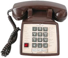 an old style telephone with the number ten on it's dial panel and cord