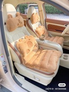 the interior of a car with teddy bears on it's seat covers and headrests