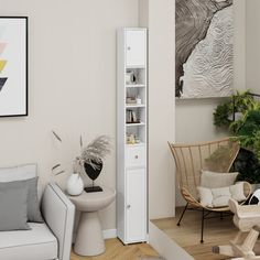 a living room filled with furniture next to a tall white book shelf and potted plant