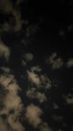 an airplane is flying in the sky at night