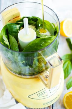 a blender filled with green vegetables and juice