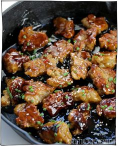 chicken wings with sesame seeds in a skillet