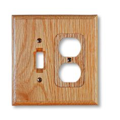 two light switch plates are shown in this wood - grained wall plate cover photo