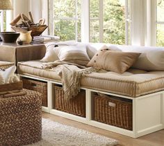 a living room filled with furniture and lots of windows