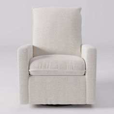 a white chair with a pillow on it's back and armrests, in front of a gray background